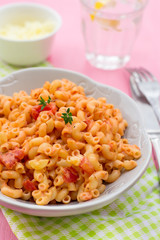 Pasta macaronis stortini coquillettes with tomato and cheese sauce