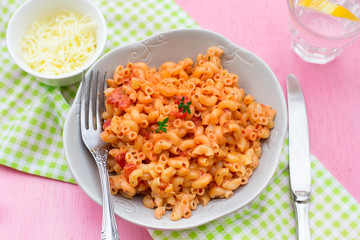 Pasta macaronis stortini coquillettes with tomato and cheese sauce