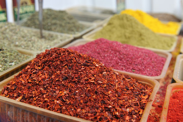 Beautiful and fresh dry seasoning of sweet pepper paprika, close-up from the seller in the market