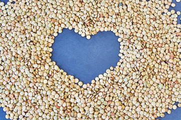 heart on a background of dry peas