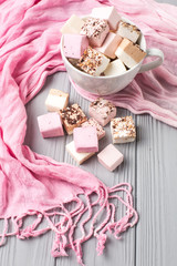 Assorted marshmallow on a gray table