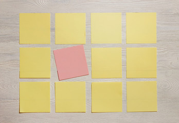 Stationary, Blank Colored Sticker Notes on White Wooden Board. Top View. Flat Lay. Time-management, Planning.