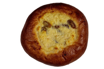 Sweet round bun with cottage cheese and raisins (cheesecake) isolated on white background