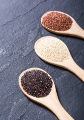 Black , white and red quinoa in spoon