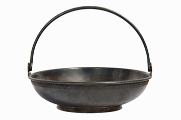 An old metal brass sugar bowl for sugar refined sugar in the form of a flat basket with a handle. Elegant dishes can be used as candy bar or vase for dried fruits and nuts. Part of the vintage service