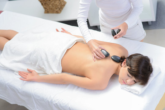 hot stone massage  with sound bowl in spa center