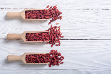 Goji berries in wooden spoon