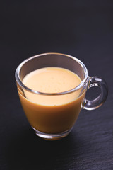 Indian turmeric milk with saffron, cardamom and turmeric. Copyspace