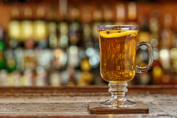 hot drink stands on a wooden bar