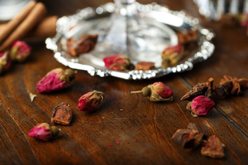 dried roses buds on the table