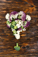 cauliflower and broccoli on a wooden background