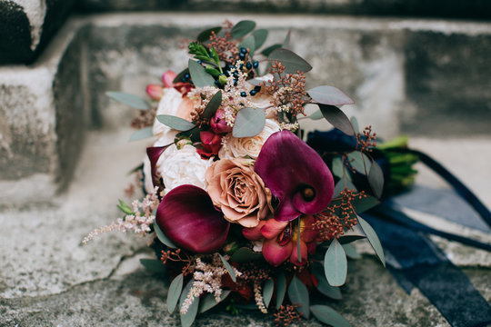 Beautiful Red Wedding Bouquet Of Bride In Style Rustic On A Stone Background