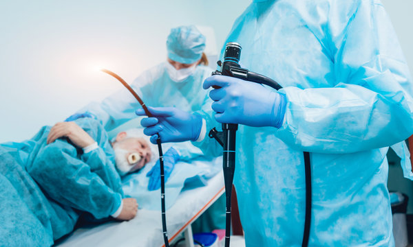 Endoscopy at the hospital. Doctor holding endoscope before gastroscopy