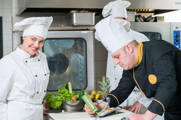 Chef Cooking, Cutting and preparing next plate