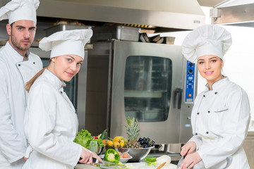 Chef Cooking, Cutting and preparing next plate