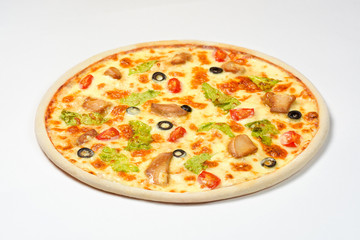 Pizza Caesar with chicken, cherry and olives on a white background