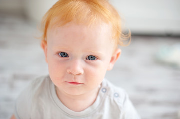 The kid looks closely at the camera closeup