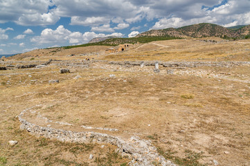 Fototapeta na wymiar Sunny view of ruins of ancient Hierapolis near Pamukkale, Denizli province, Turkey.