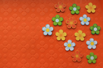 Floral colorful decorations on bright orange background