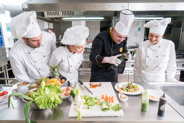 Chef Cooking, Cutting and preparing next plate