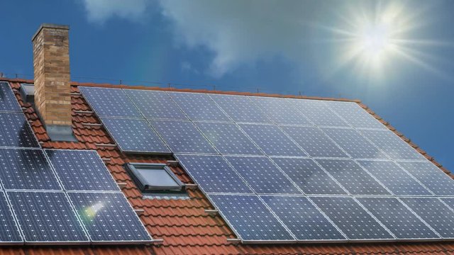 Time lapse animation of photovoltaic solar panels on house.