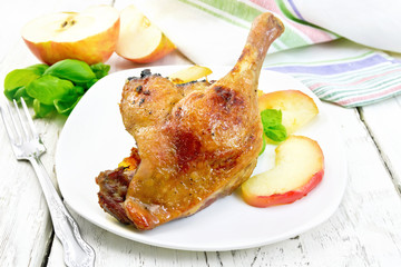 Duck leg with apple on light board