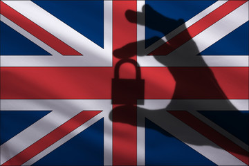 Great Britain closed lock in the hand. Import and export of goods from the world market of trade is prohibited. Closed borders for tourists and immigrants. Epidemic virus Top Secret Information