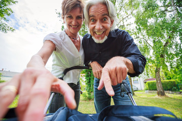Grandparents Looking At Their Grandchild