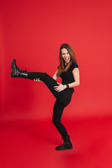 Full length of a cheerful casual girl dancing