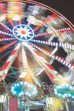 Ferris wheel at night with motion blur, abstract backround