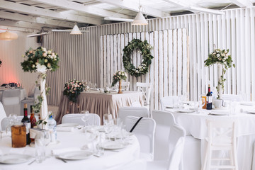 Wedding banquet decorated with decor, flowers and other design elements