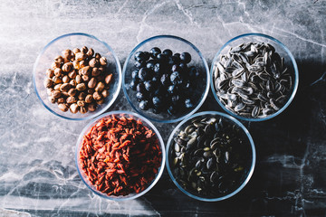 Five bowls of colorful healthy snacks