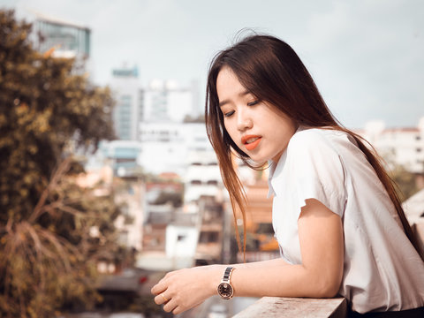 student and gradutation concept from asian beautiful girl(20s to 30s) with long black hair smile and happiness feeling with asia architecture background