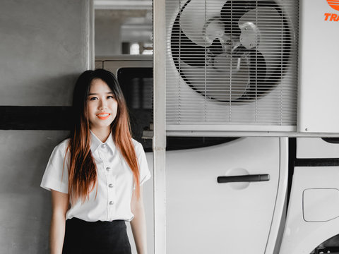 student and gradutation concept from asian beautiful girl(20s to 30s) with long black hair smile , .lively, fresh and happiness feeling with asia car park background