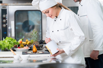 Chef Cooking, Cutting and preparing next plate