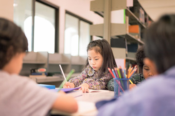 In Selective focus of serious girl Learning Class in Library. Development of Human Resources in Education Concept.