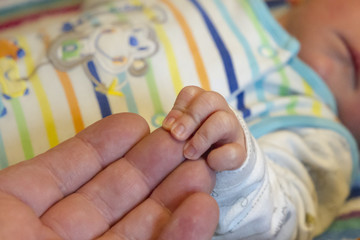 The hand of a newborn baby