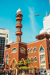Kuala Lumpur cityscape. Religious architecture. Travel to Malaysia. Mosque Masjid India. City tour. Tourism industry. Building facade. Urban background. Vertical