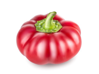 Raw red pepper with green tail, cut out with the texture. Side view, closeup isolated on white background. Sweet red pepper, ready to use in your project.