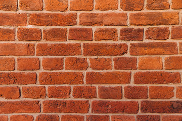 Fototapeta premium Brick wall texture background. Red brick texture. Builduing facade. Empty room with brick wall. Gradient for background usage. Abstract close up shot.