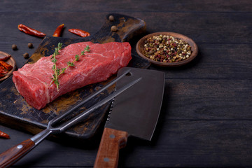 Raw beef steak meat and knife and fork