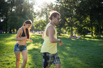 Man and woman dancing Latin American in summer park