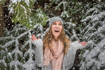 Happy young woman walking in winter time