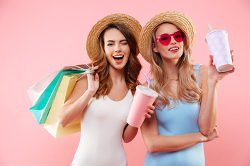 Portrait of a two happy girls dressed in swimsuits