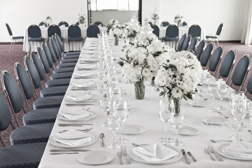 living room decorated with white flowers for reception