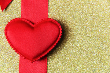 red heart on a Red Ribbon and the golden background