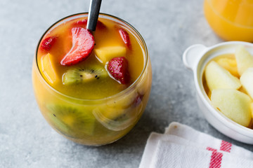 Tropical Cocktail Sangria with White Wine, Pineapple Juice, Strawberries, Kiwi, Mango and Apple.