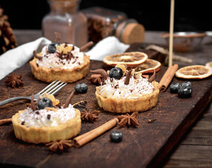 cakes with white cream and sprinkled with chocolate