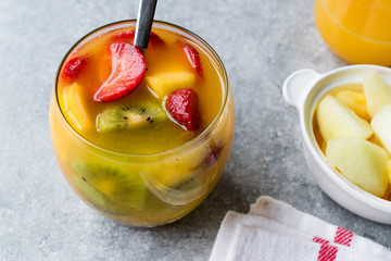 Tropical Cocktail Sangria with White Wine, Pineapple Juice, Strawberries, Kiwi, Mango and Apple.