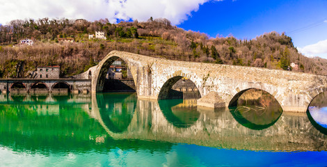 Ponte della Maddalena- picturesque scenery with ancient bridge in the Italian province of Lucca - obrazy, fototapety, plakaty